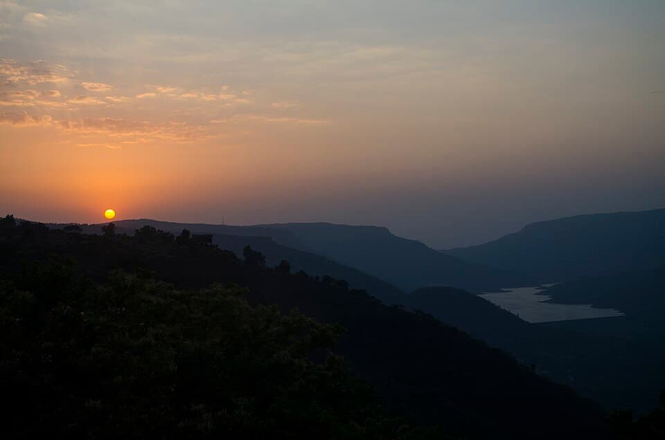 Sunset over Dhom lake, below Mahabaleshwar, on the Sahyadri ghats route